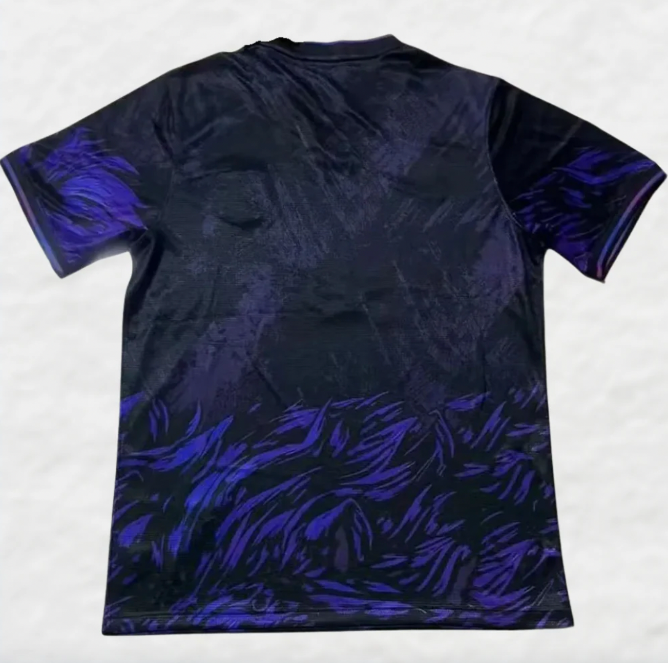 Camiseta de fútbol del FC Barcelona con el león morado